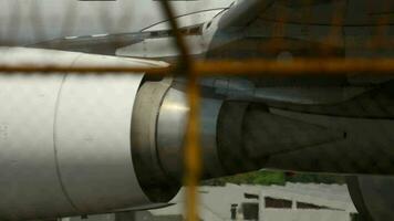 Huge airplane jet engine close up view moving forward heat haze. Modern engine of passenger aircraft in airport video