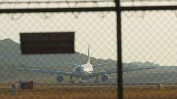 Passengers airplane landing to airport runway, mileage and braking speed reduction video