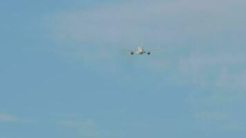 Long shot, jet airplane climb after takeoff in blue sky. Passenger flight departs. Airliner leaving video