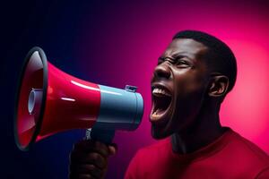 Happy man holding megaphone on bright color background photo