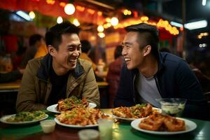 Group of young male friends eating happily at a street food market photo