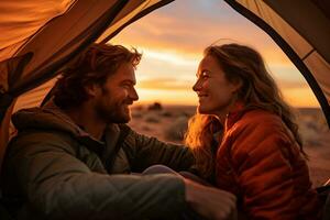 Happy couple picnicking in a tent at the riverside photo