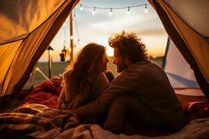 Happy couple picnicking in a tent at the riverside photo