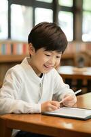 Boy using a tablet for online learning. photo