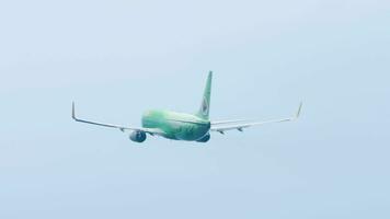 PHUKET, THAILAND FEBRUARY 03, 2023 - Boeing 737 of Nok Air take off at Phuket Airport. Jet plane departure. Aircraft climbing, side view. Tourism and travel concept video