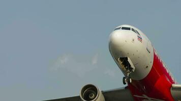 PHUKET, THAILAND JANUARY 23, 2023 - Passenger plane Airbus A320 of AirAsia took off, closed the landing gear. Airliner climbing, flying overhead video