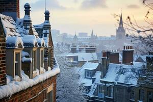 Snow covered rooftops and chimneys in historical British cities background with empty space for text photo
