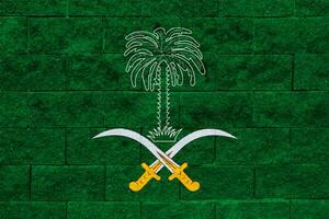 Flag and coat of arms of Kingdom of Saudi Arabia on a textured background. Concept collage. photo