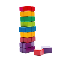 Colorful blocks stacked high in a tower, ready to topple isolated png