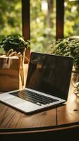 Online shopping with a laptop and credit card on a table photo