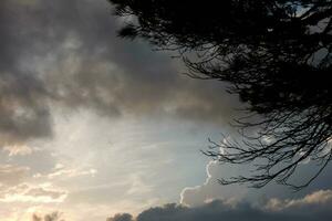 Scattered clouds in the sky indicating a change in weather. photo