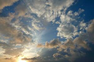 Scattered clouds in the sky indicating a change in weather. photo