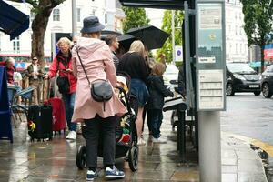 Most Beautiful Image of International and Local Tourist People are Visiting The Central London Capital City of England UK During Rainy Day. Captured on August 2nd, 2023 photo