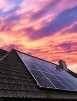 Solar panels producing clean energy on a roof of a residential house photo