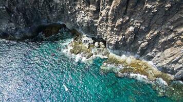 Large rock formations that look like Los Gigantes right on the atlantic ocean on the Canary Island of Tenerife. photo