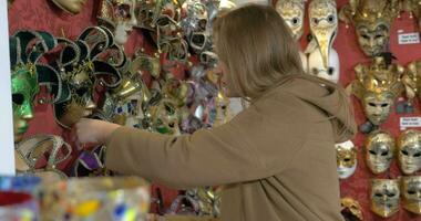 Woman in the store of Venetian masks video