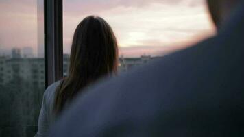 Young couple on the balcony at sunset video