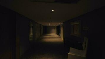 Walking in hotel hallway, view in dim light video