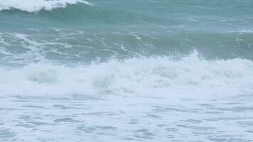 Aerial view of sea waves crashing on rocks cliff in the blue ocean. Top view of coastal rocks in Phuket ocean. Landscape view point of Laem Phromthep Cape in the morning. video