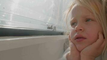 Serene Child Dreaming on Sunlit Bed Inside Camper video