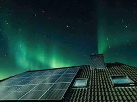 Solar panels producing clean energy on a roof of a residential house photo