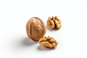 a walnut and a walnut shell on a white surface photo