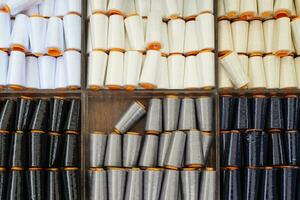 Detailed close up view on samples of cloth and fabrics in different colors found at a fabrics market photo