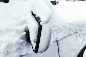 Car in winter in the snow, Cleaning the car photo