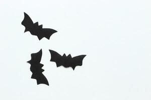 Paper bats on a purple background, Halloween concept photo