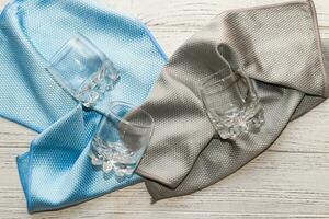 a rag with a special texture for cleaning glass glasses and dishes for home use. photo