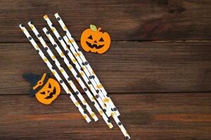 Cocktail sticks on a wooden table, Halloween concept photo