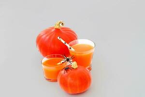 Pumpkin with juice on a wooden table, Halloween concept photo