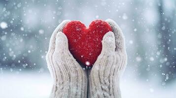 Female hands in mittens holding red heart on snowy winter background. Generative AI photo