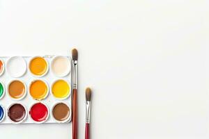 Watercolor paints and brush isolated on white background. Top view. Generative AI photo