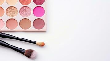 Makeup brushes and eye shadow palette on white background with copy space, top view. Generative AI photo