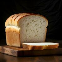 A loaf of fresh white bread with sliced pieces. High resolution. AI Generative photo