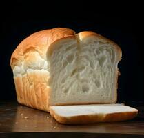 A loaf of fresh white bread with sliced pieces. High resolution. AI Generative photo