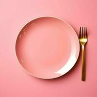 Pink ceramic plate with fork lying next to on pink background. High resolution. AI Generated photo