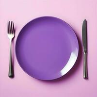 A violet ceramic plate with a fork and knife lying next to on violet background. High-resolution. AI Generative photo