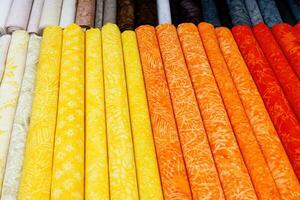 Close up view on samples of cloth and fabrics in different colors. photo