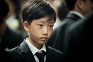 Portrait of little asian boy with sad expression.Funeral concept AI generated photo