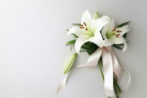 White lily bouquet with ribbon on white background.Funeral Concept AI generated photo