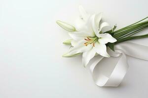 White lily bouquet with ribbon on white background.Funeral Concept AI generated photo