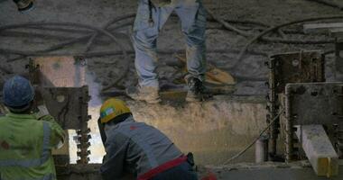 View of worker welding reinforcement of constructed building Hong Kong, China video