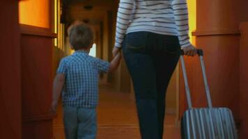 Mother with son leaving the hotel video