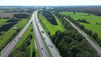 Aerial view on the A7 motorway in northern Germany between fields and meadows. photo