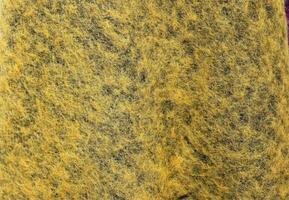 Detailed close up view on samples of cloth and fabrics in different colors found at a fabrics market photo