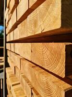 A large pile of wood on sale in a wholesale shop. photo