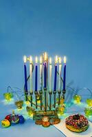 Happy jewish holiday celebrates Hanukkah menorah. photo