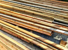 A large pile of wood on sale in a wholesale shop. photo